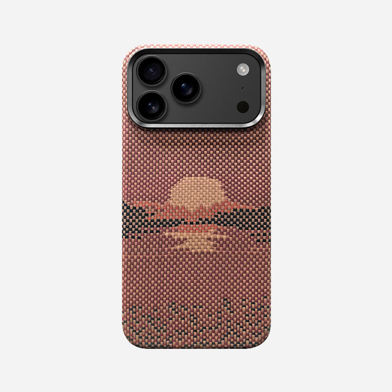 Dune Rise aramid fiber case for iPhone 18 with a woven sunrise over dunes in warm terracotta, thumbnail